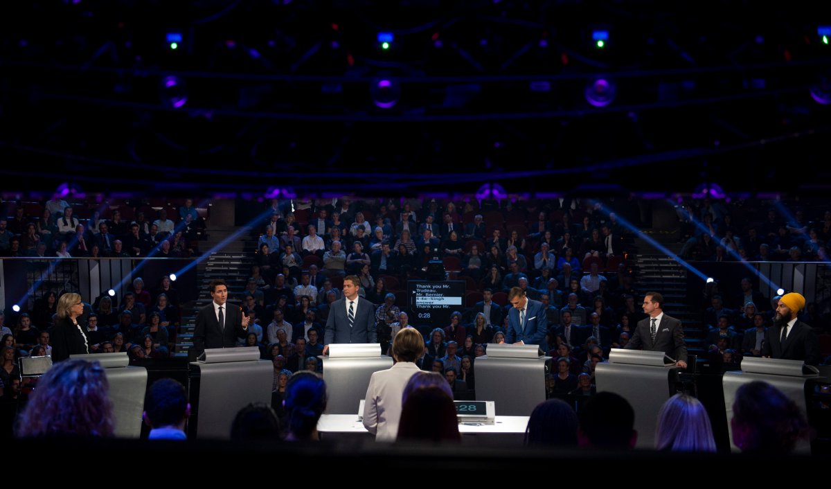 Liberal Leader Justin Trudeau, second from left, speaks as Green Party Leader Elizabeth May, Conservative Leader Andrew Scheer, People's Party of Canada Leader Maxime Bernier, Bloc Québécois Leader Yves-François Blanchet and NDP Leader Jagmeet Singh look on during the federal leaders' debate in Gatineau, Que., Monday, Oct. 7, 2019.