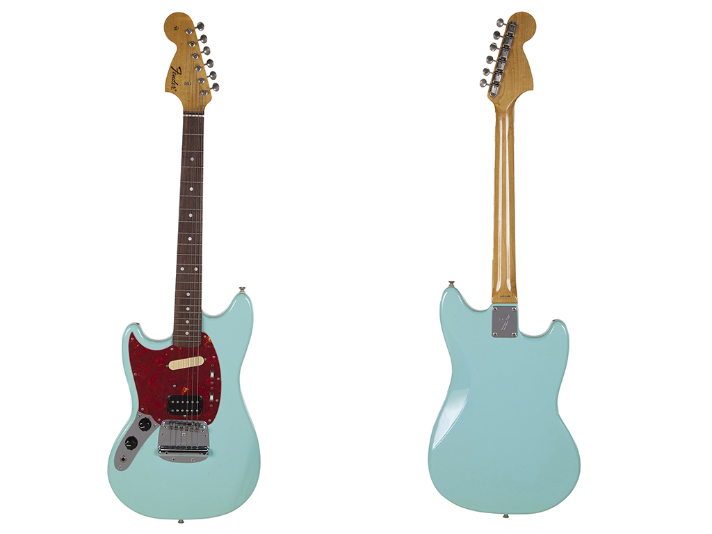 This combination photo of images released by Julien’s Auctions shows the front and back of a turquoise-bodied, left-handed Fender guitar built in 1993 and used by Nirvana frontman Kurt Cobain during the band’s In Utero tour.
