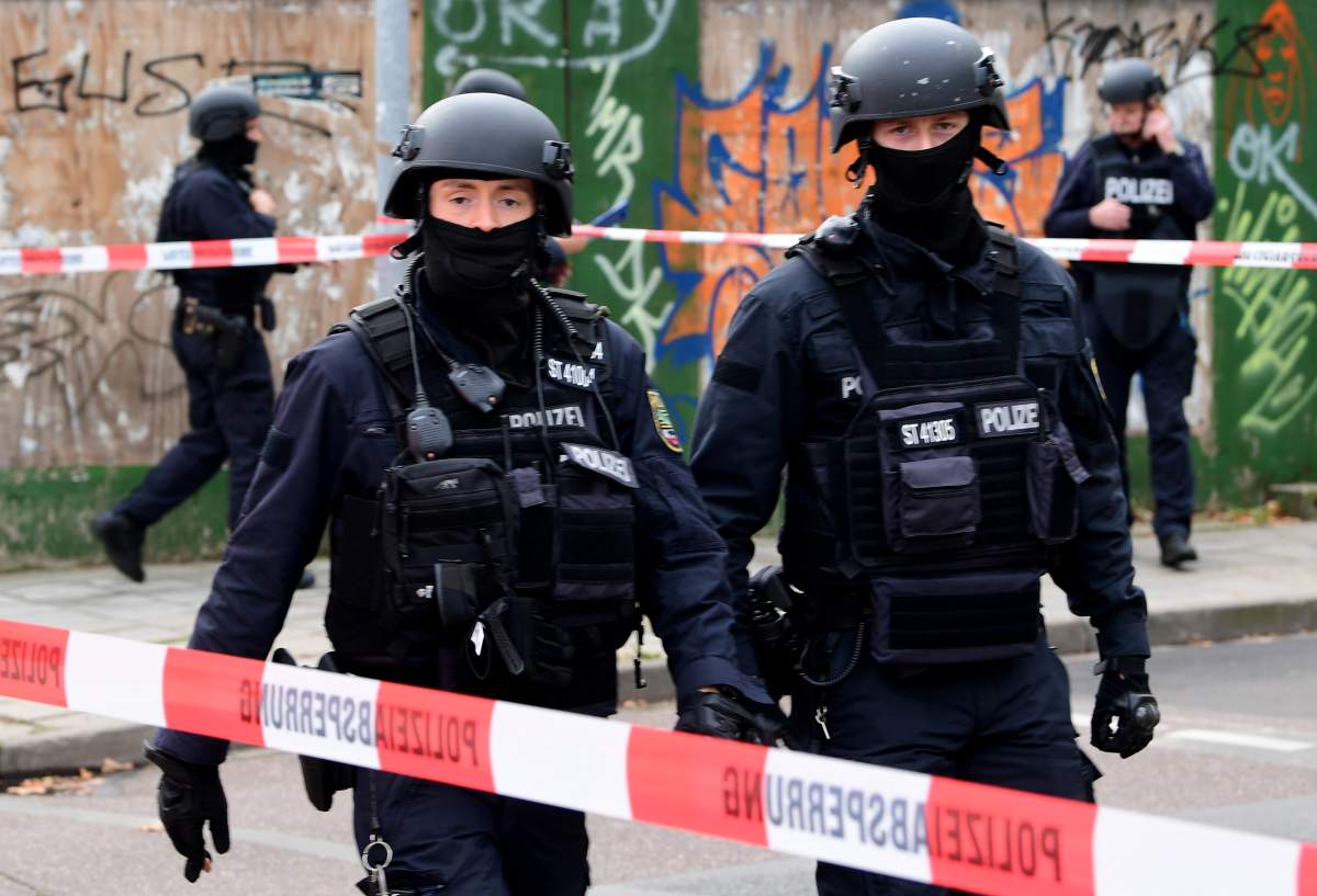Police guard a crime scene near a Synagogue after a shooting in Halle, Germany, 09 October 2019.