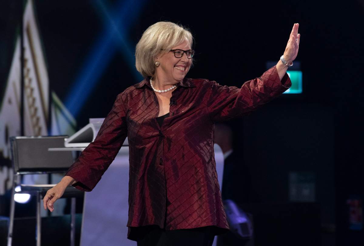 Green Party leader Elizabeth May waves as she walks on stage for the Federal leaders French language debate in Gatineau, Que. on Thursday, October 10, 2019.
