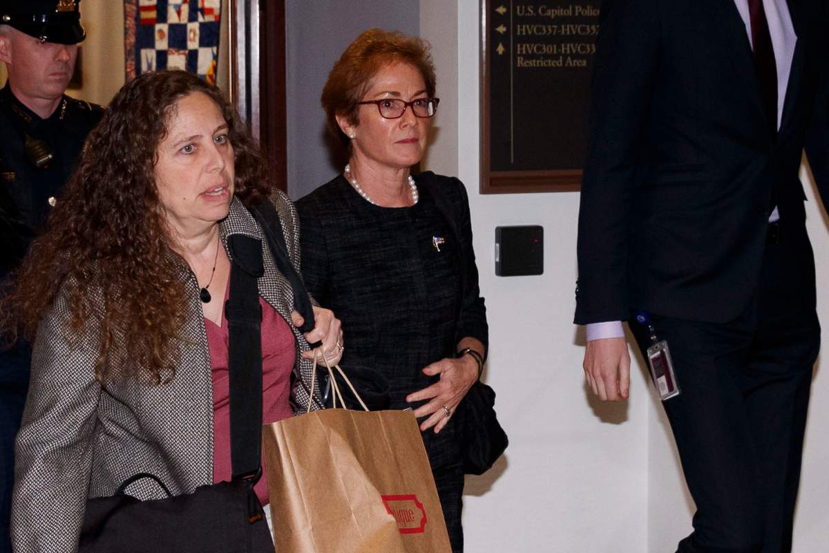 Former U.S. ambassador to Ukraine, Marie Yovanovitch, second from left, departs after meetings with House members, on Capitol Hill, Friday, Oct. 11, 2019, in Washington. (AP Photo/Alex Brandon)