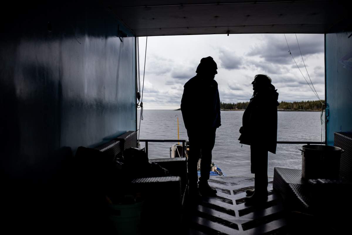 Crew members chat on board a shark research vessel in LaHave, N.S., Friday, Oct. 4, 2019. THE CANADIAN PRESS/Riley Smith