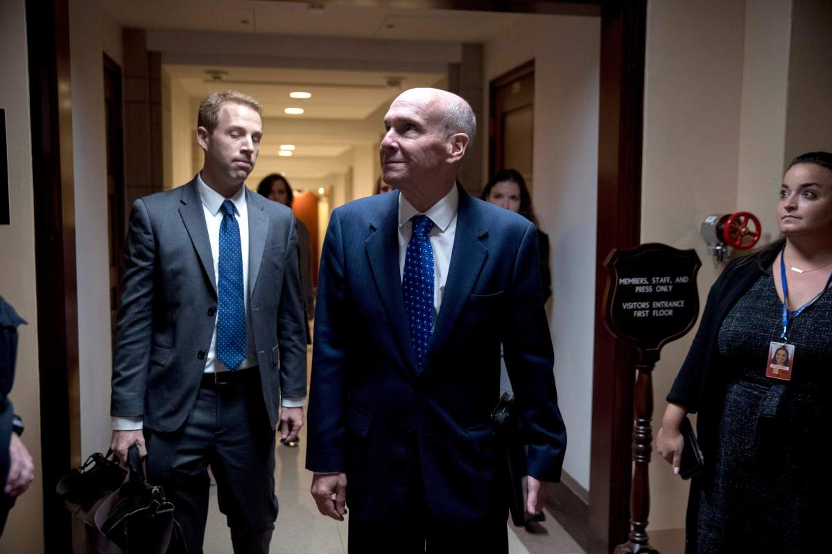 Michael McKinley, a former top aide to Secretary of State Mike Pompeo, leaves Capitol Hill in Washington, Wednesday, Oct. 16, 2019. (AP Photo/Andrew Harnik)