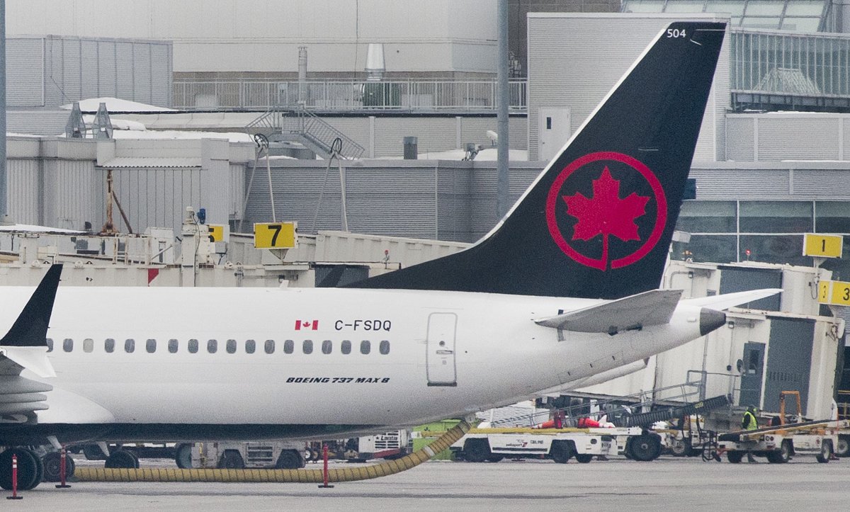 An Air Canada Boeing 737 Max 8 aircraft is shown next to a gate at Trudeau Airport in Montreal on March 13, 2019. 