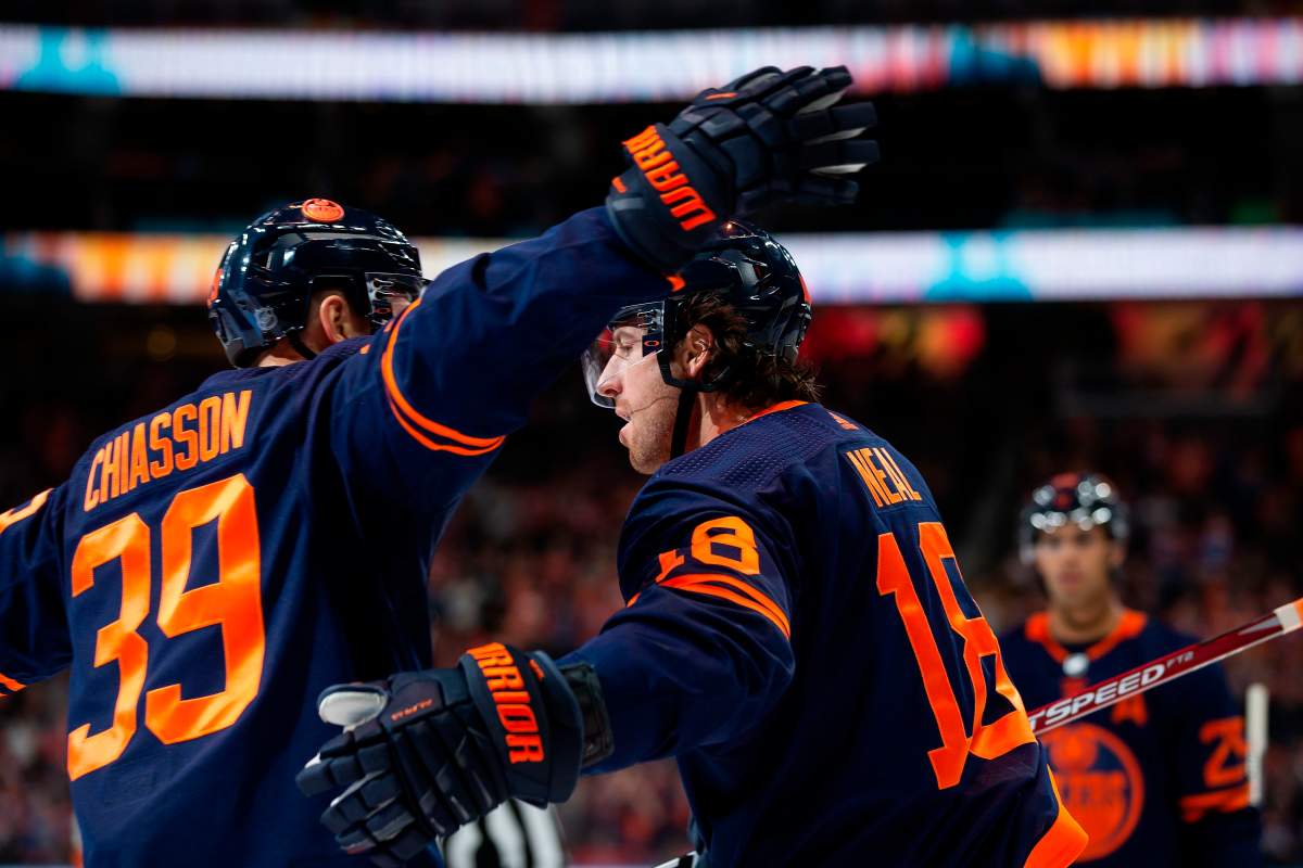Edmonton Oilers left wing James Neal (18) celebrates his goal against the Detroit Red Wings with teammate Alex Chiasson (39) during the second period in Edmonton on Friday, Oct. 18, 2019. THE CANADIAN PRESS/Codie McLachlan.