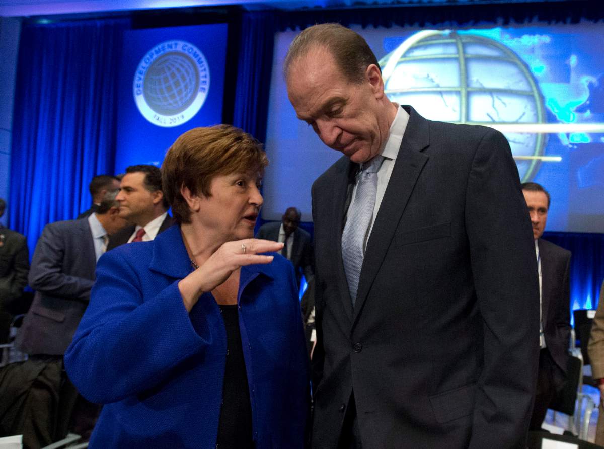International Monetary Fund (IMF) Managing Director Kristalina Georgieva speaks with World Bank President David Malpass during the Development Committee plenary at the World Bank/IMF Annual Meetings in Washington, Saturday, Oct. 19, 2019. 
