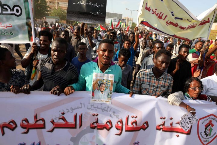 Sudanese protesters hold a banner with Arabic inscription reading 'Khartoum resistance committee' during a march in Khartoum, Sudan, 21 October 2019. 