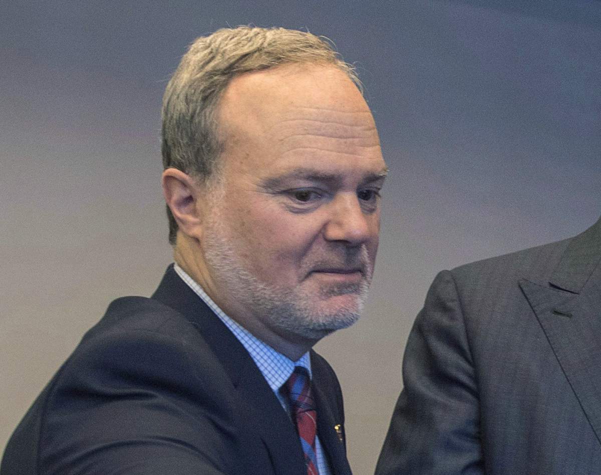 Andre Pratte attends the launch of the book "Legacy," Monday, November 14, 2016 in Montreal. Andre Pratte is announcing his resignation from the Senate as the federal election results are rolling in. 