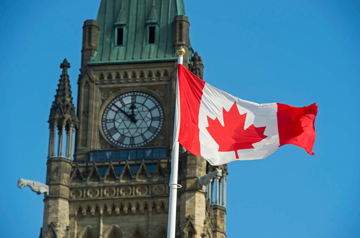 A Canadian flag flies near the Peace Tower on Parliament Hill in Ottawa on Wednesday, Oct. 23, 2019.