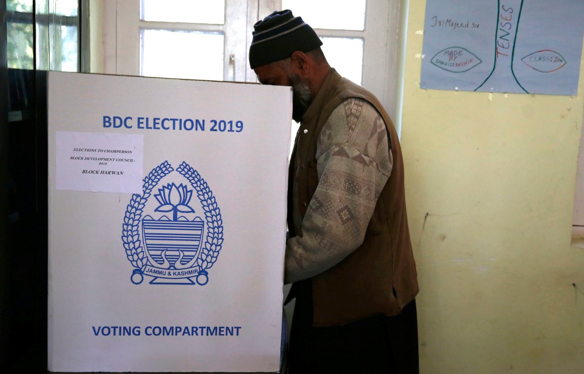 A sarpanch (village head) casts his vote at a polling booth Chek Dara on the outskirts of  Srinagar, the summer capital of Indian Kashmir, 24 October 2019. 