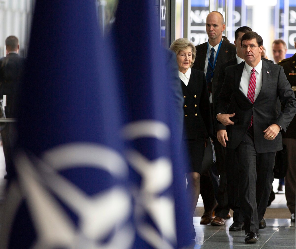 U.S. Secretary for Defense Mark Esper (R) and U.S. Ambassador to NATO Kay Bailey Hutchison (L) arrive for a meeting of NATO defense ministers at NATO headquarters in Brussels, Belgium, 24 October 2019. 