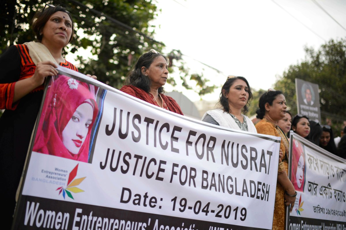 In this Friday, April 19, 2019, file photo, protesters gather to demand justice for an 18-year-old woman Nusrat Jahan Rafi who was killed after she was set on fire for refusing to drop sexual harassment charges against her Islamic school's principal, in Dhaka, Bangladesh.