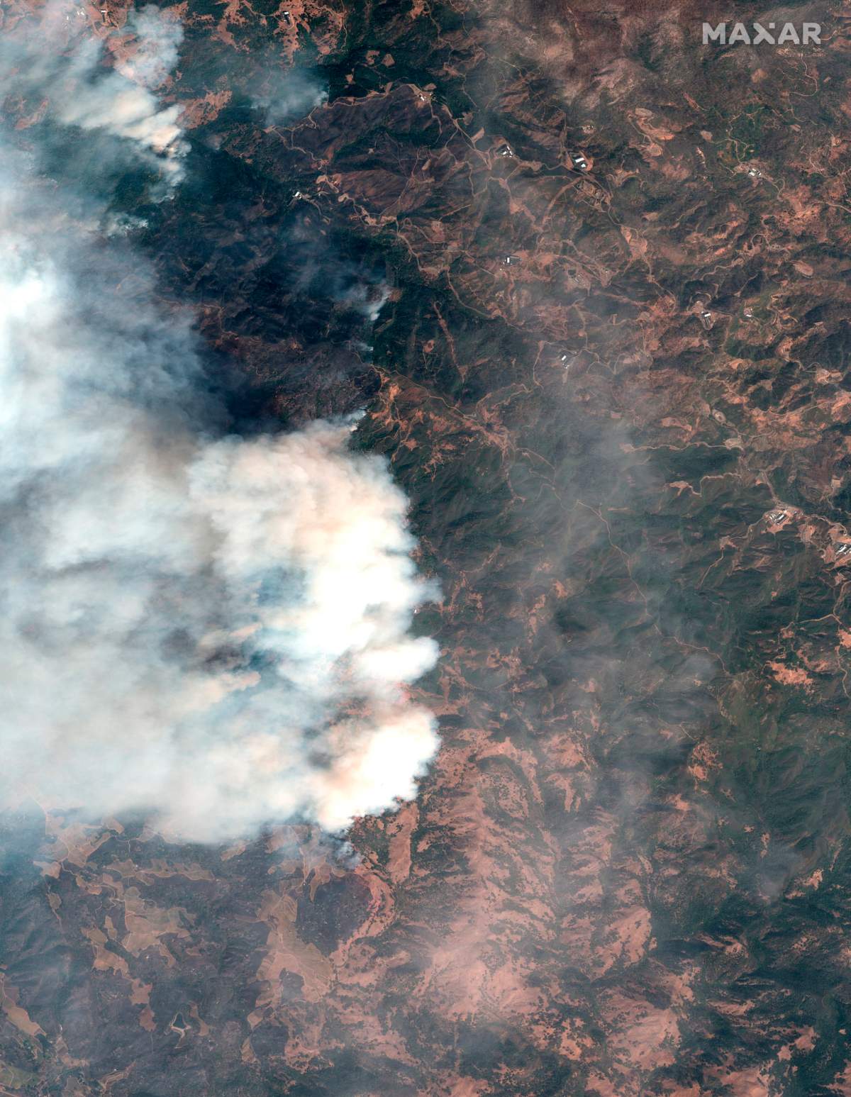 This satellite image provided by Maxar Technologies shows a wildfire burning in Sonoma County, Calif., on Thursday, Oct. 24, 2019.