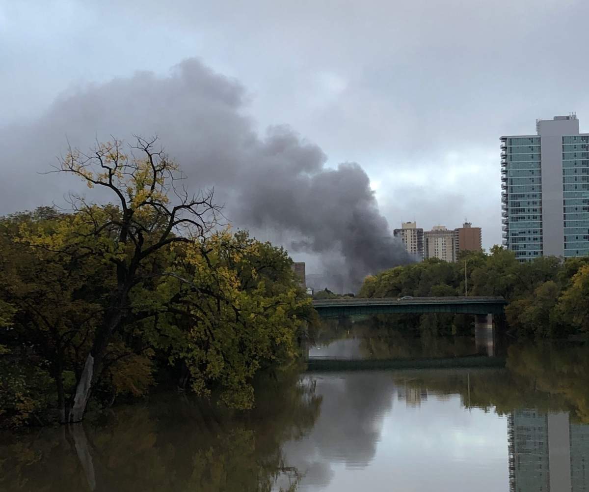 Thick smoke billows from under the Osborne Street Bridge.