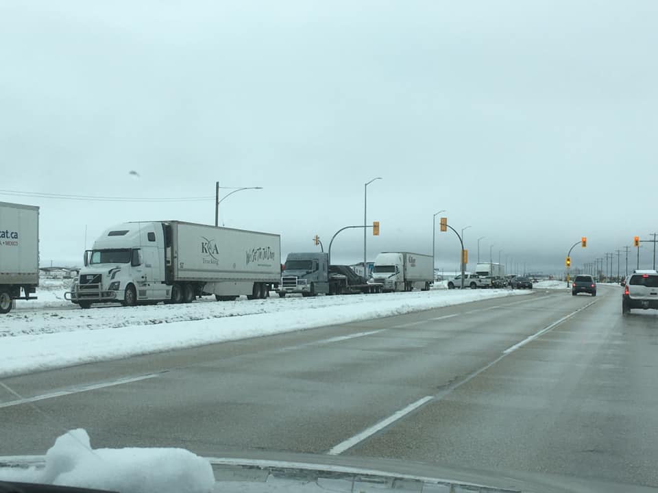 Trucks lined up on the TransCanada Highway Saturday.