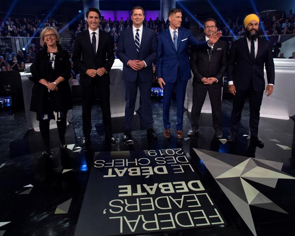 Federal party leaders Green Party leader Elizabeth May, Liberal leader Justin Trudeau, Conservative leader Andrew Scheer, People's Party of Canada leader Maxime Bernier, Bloc Quebecois leader Yves-Francois Blanchet and NDP leader Jagmeet Singh pose for a photograph before the Federal leaders debate in Gatineau, Que. on Monday, October 7, 2019.