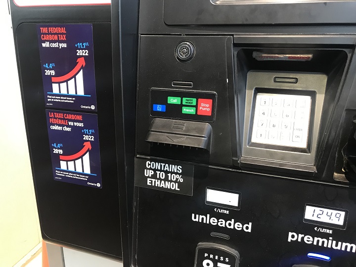 An anti-carbon gas sticker is displayed at a gas pump on September 27, 2019.