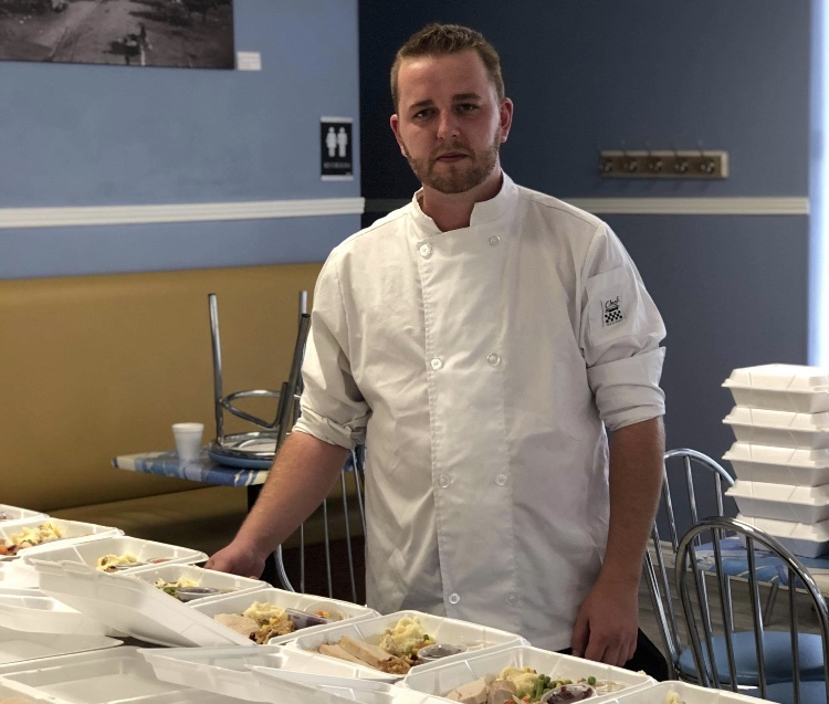 Early Riser Cafe owner Brad Heslop and his friends teamed up to support community members in need by cooking a classic Thanksgiving meal and delivering it to their front doors last year.