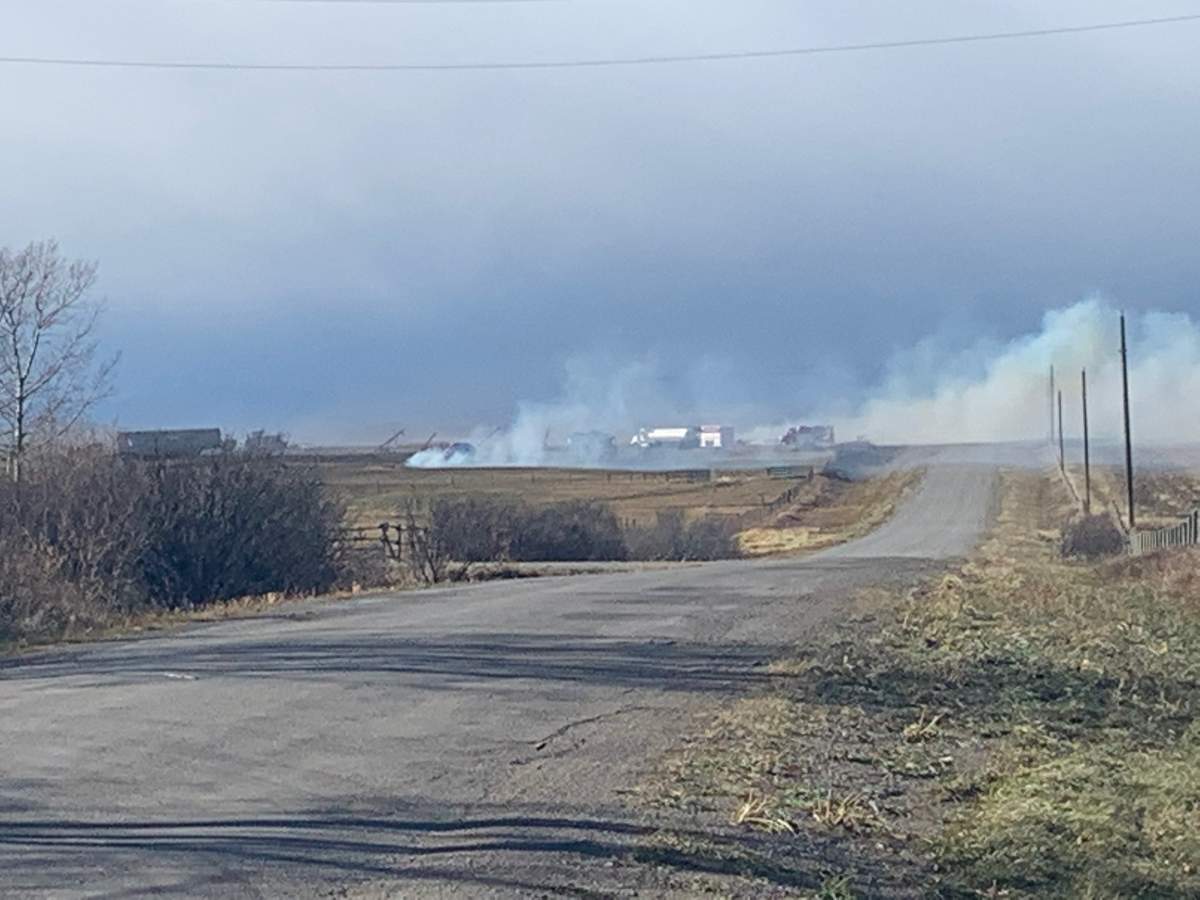 Smoke can be seen in the distance from two separate grass fires in southern Alberta on Oct. 25, 2019.