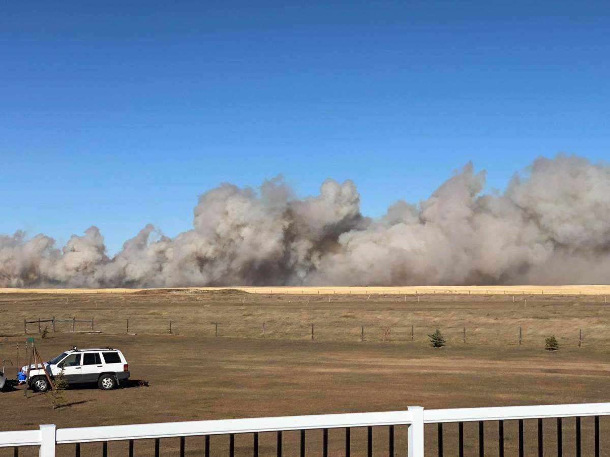 Smoke seen billowing from a grass fire in the High River area on Friday, Oct. 25.