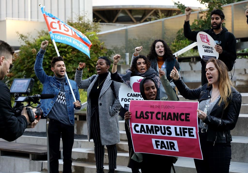 Students protest outside court before a hearing in Toronto on Friday, Oct. 11, 2019. The students are challenging the Ontario government’s “student choice initiative,” which makes certain supplementary fees optional.