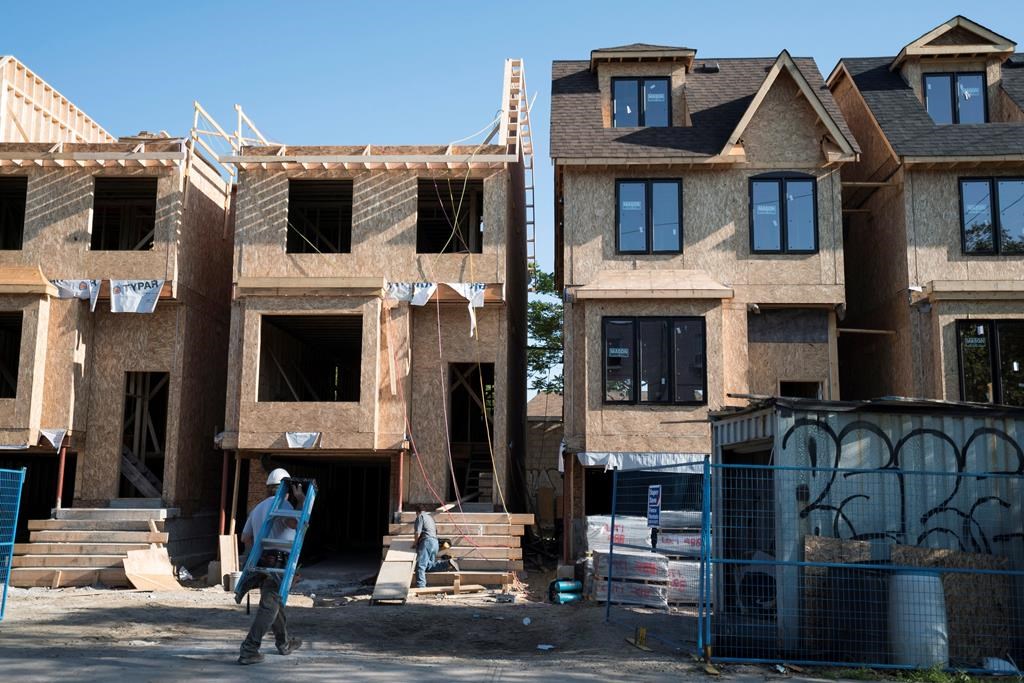 Houses under construction in Toronto on Friday, June 26, 2015. Canada Mortgage and Housing Corp. says the pace of housing starts in September slowed compared with August. THE CANADIAN PRESS/Graeme Roy.