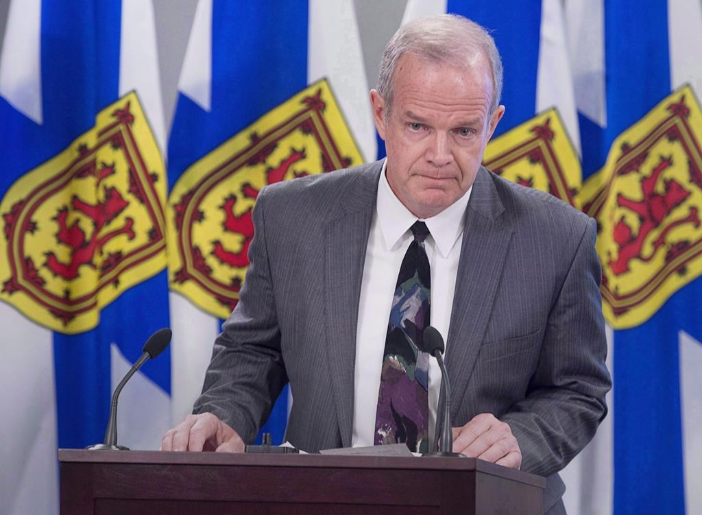 Justice Minister Mark Furey listens to a question in Halifax on Tuesday, April 3, 2018. Unexpected deaths in Nova Scotia as a result of domestic violence or involving children in care or custody of the province would be subject to review by two expert committees under proposed legislative changes.