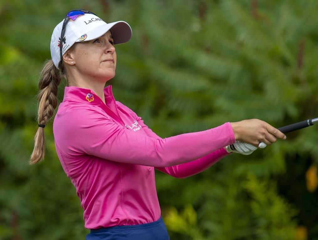 Anne-Catherine Tanguay, of Quebec City, watches her approach shot from the fairway of the ninth hole during the third round of the CP Women's Open in Aurora, Ont., Saturday, Aug. 24, 2019.