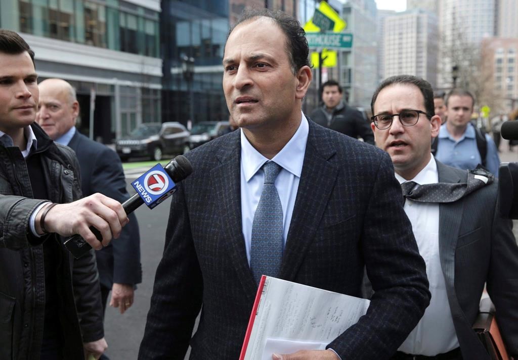 A well-known businessman and philanthropist from British Columbia faces fresh allegations in a new indictment filed in a college bribery scandal unfolding in the United States. David Sidoo, of Vancouver, leaves following his federal court hearing in Boston, Friday, March 15, 2019.