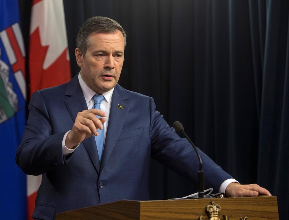 Premier Jason Kenney speaks to the media in Edmonton, Alberta, on Tuesday Oct. 22, 2019. The Alberta government is tabling a budget today that will cut overall spending on programs by nearly three per cent.