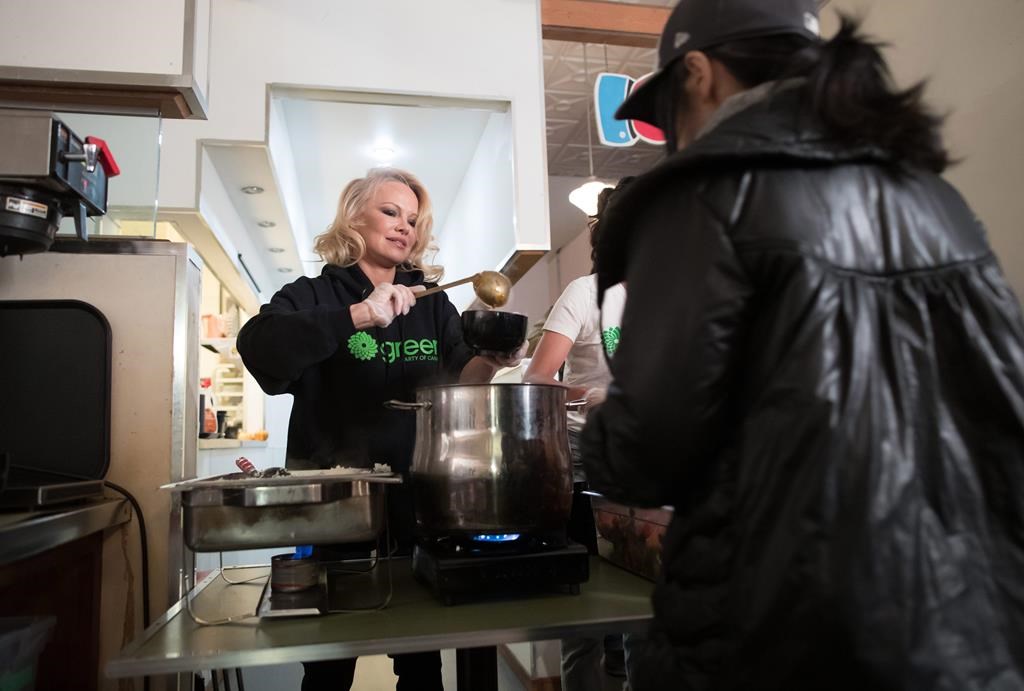 Actress and animal rights activist Pamela Anderson serves free vegan meals during an event held by Green Party candidate for East Vancouver on Wednesday October 9, 2019.