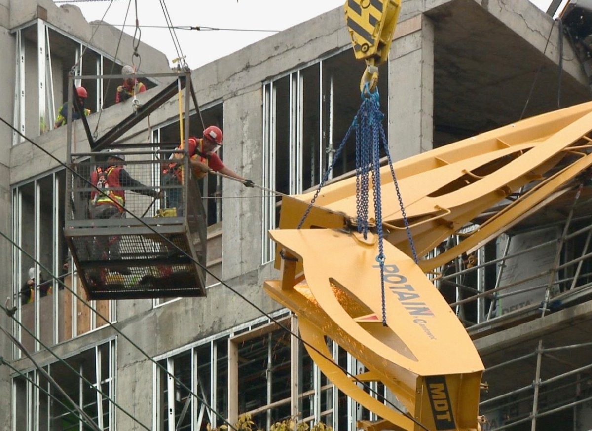 Crews work to remove the toppled crane in downtown Halifax on Monday, Oct. 14, 2019. 