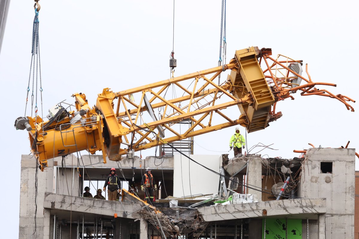 The final piece of a collapsed construction crane is removed by a construction crew on Oct. 26, 2019. 