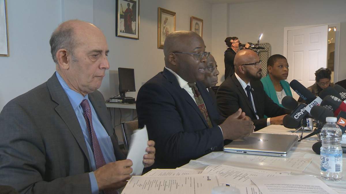 Coun. Marvin Rotrand, Black Coalition of Quebec president Dan Philip and CRARR advisor Alain Babineau join for a press conference on street checks on Oct. 25, 2019. 