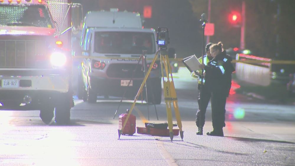 Investigators at the scene of the collision Saturday.