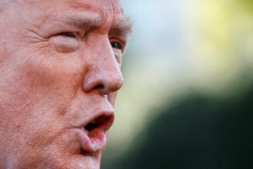 President Donald Trump speaks to members of the media on the South Lawn of the White House in Washington, Thursday, Oct. 10, 2019, before boarding Marine One for a short trip to Andrews Air Force Base, Md., and then on to Minneapolis, for a campaign rally.