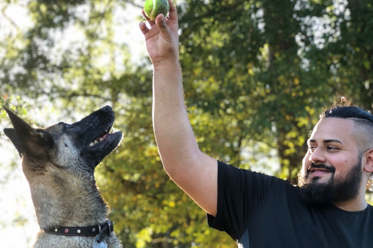 Alex Coreas is shown with one of his dogs in this photo released by his family.