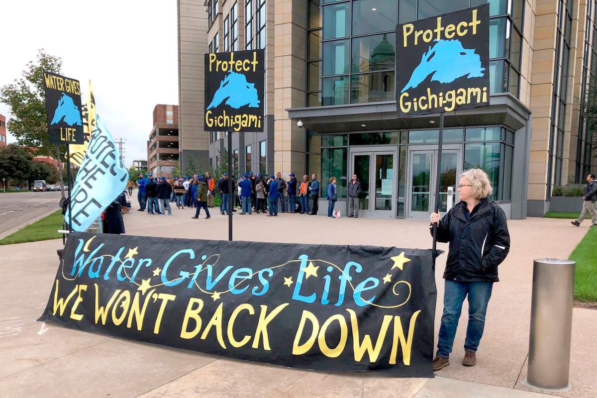 Opponents of Enbridge Energy’s plan to replace its aging Line 3 crude oil pipeline across northern Minnesota, protest Tuesday, Oct. 1, 2019, in St. Paul, before a state Public Utilities Commission meeting on the project.