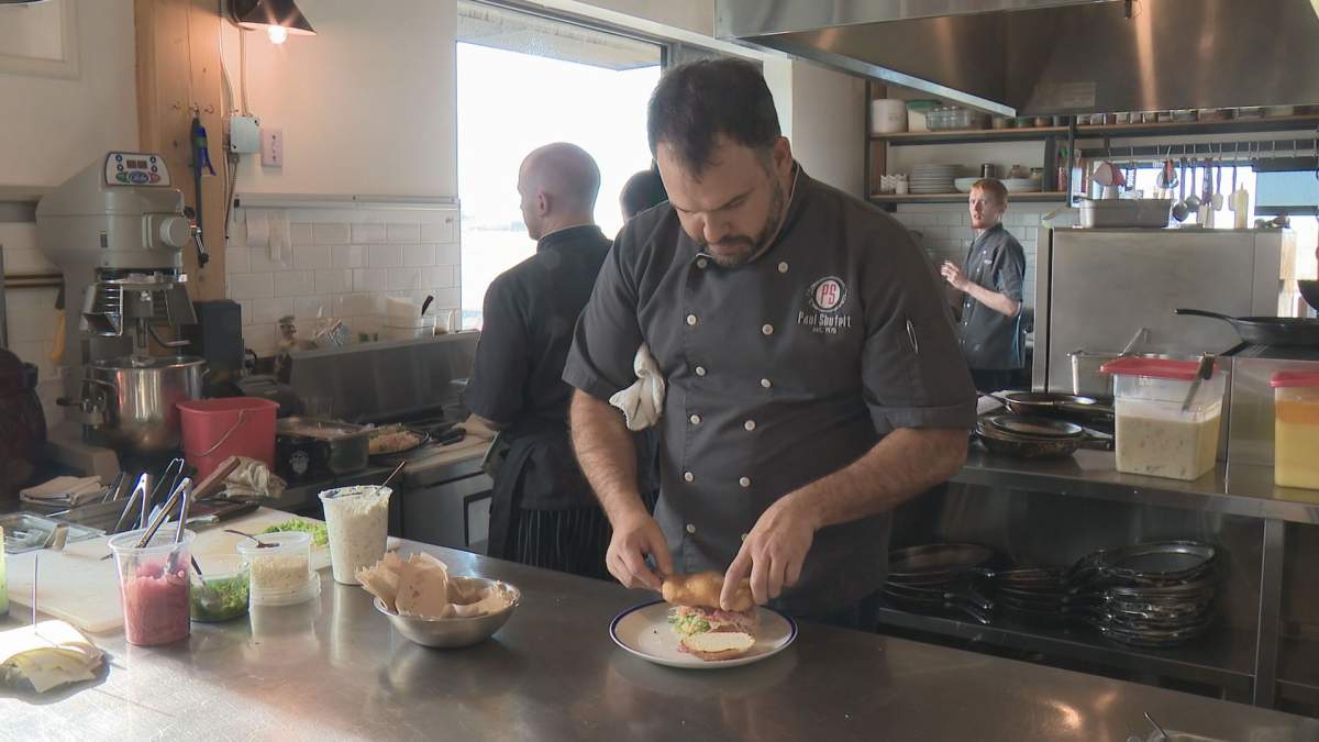 Woodshed Burgers owner Paul Shufelt prepares the newly named McEffing Fish Filet.