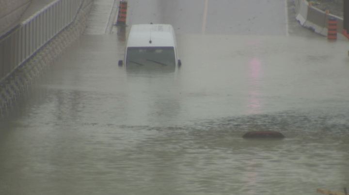 Just a small portion of one of the vehicles could be seen above the flood waters on Torbram Road in north Mississauga.