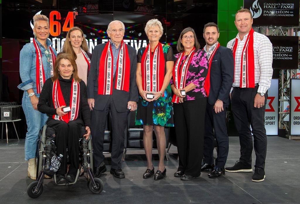 Canada's Sports Hall of Fame 2019 inductees (left to right) Waneek Horn-Miller, Colette Bourgonje (front), Jayna Hefford, Doug Mitchell, Guylaine Bernier, Vicki Keith, Alexandre Bilodeau and Martin Brodeur pose for a group photo in Toronto on Wednesday, October 23, 2019.
