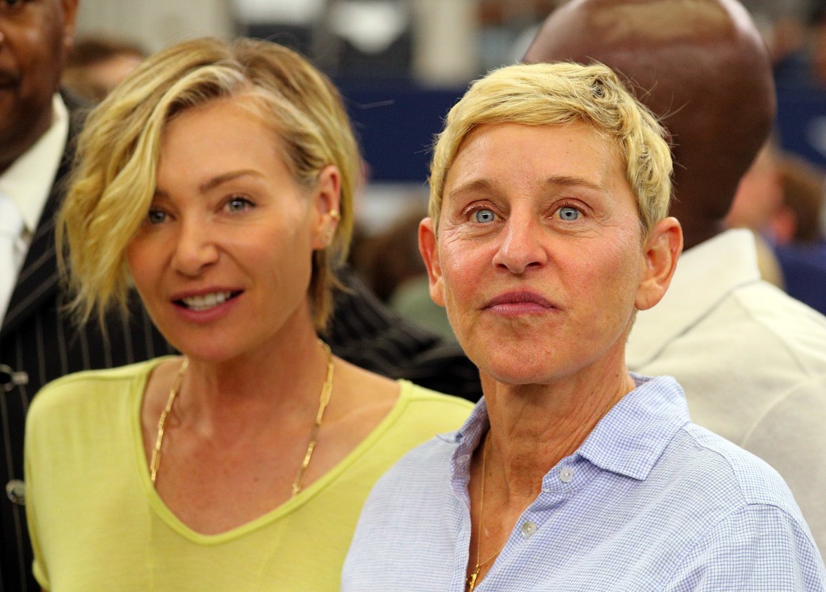 Portia de Rossi and Ellen DeGeneres watch the Green Bay Packers and Dallas Cowboys warm up before the game at AT&T Stadium on October 06, 2019 in Arlington, Texas.