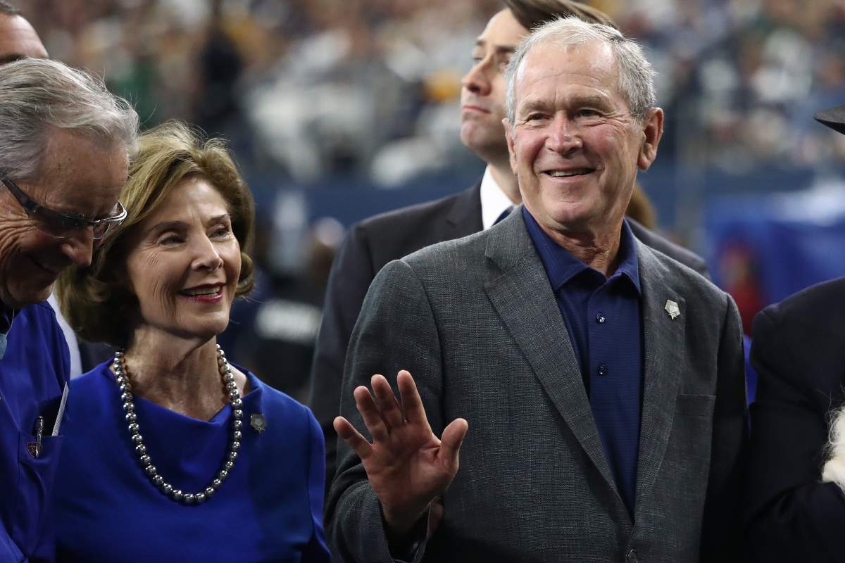 Former President George W. Bush and former First Lady Laura Bush attend the NFL game between the Dallas Cowboys and the Green Bay Packers at AT&T Stadium on Oct. 6, 2019 in Arlington, Texas. (Photo by Ronald Martinez/Getty Images)