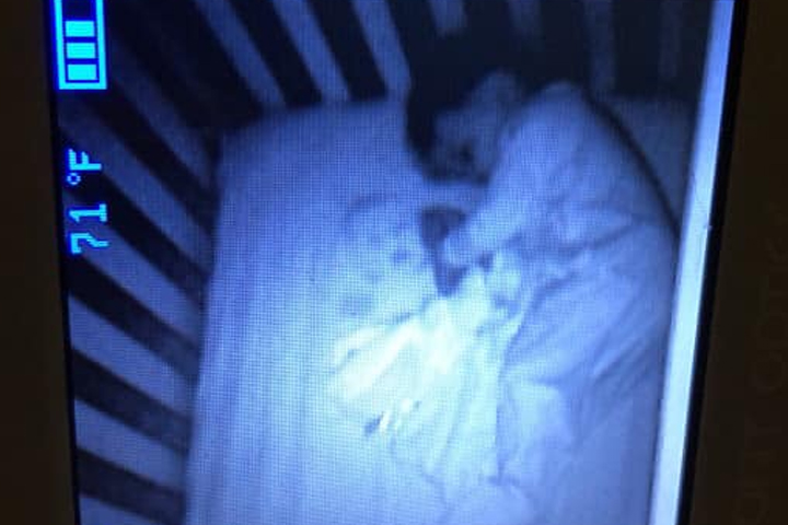 Maritza Cibuls' son, Lincoln, is shown beside a ghostly baby face that appeared in his crib.