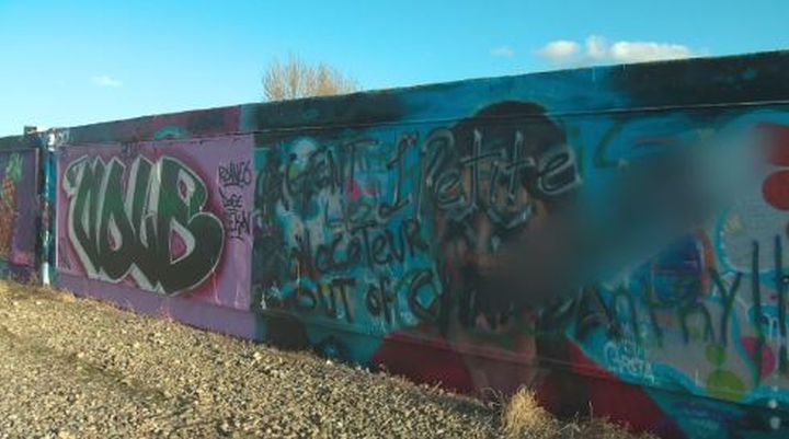 This Oct. 20, 2019 picture shows several layers of graffiti covering up a mural in Edmonton that was painted by street artist AJA Louden.