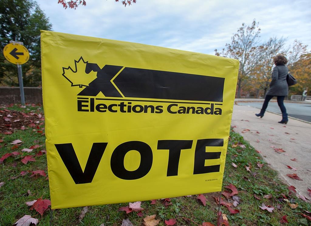 A voter heads to cast their vote in Canada's federal election at the Fairbanks Interpretation Centre in Dartmouth, N.S., Monday, Oct. 21, 2019. THE CANADIAN PRESS/Andrew Vaughan.