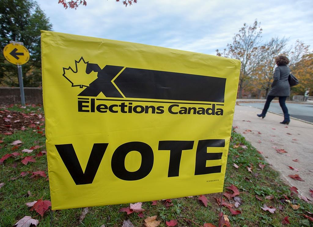 A voter heads to cast their vote in Canada's federal election at the Fairbanks Interpretation Centre in Dartmouth, N.S., Monday, Oct. 21, 2019.