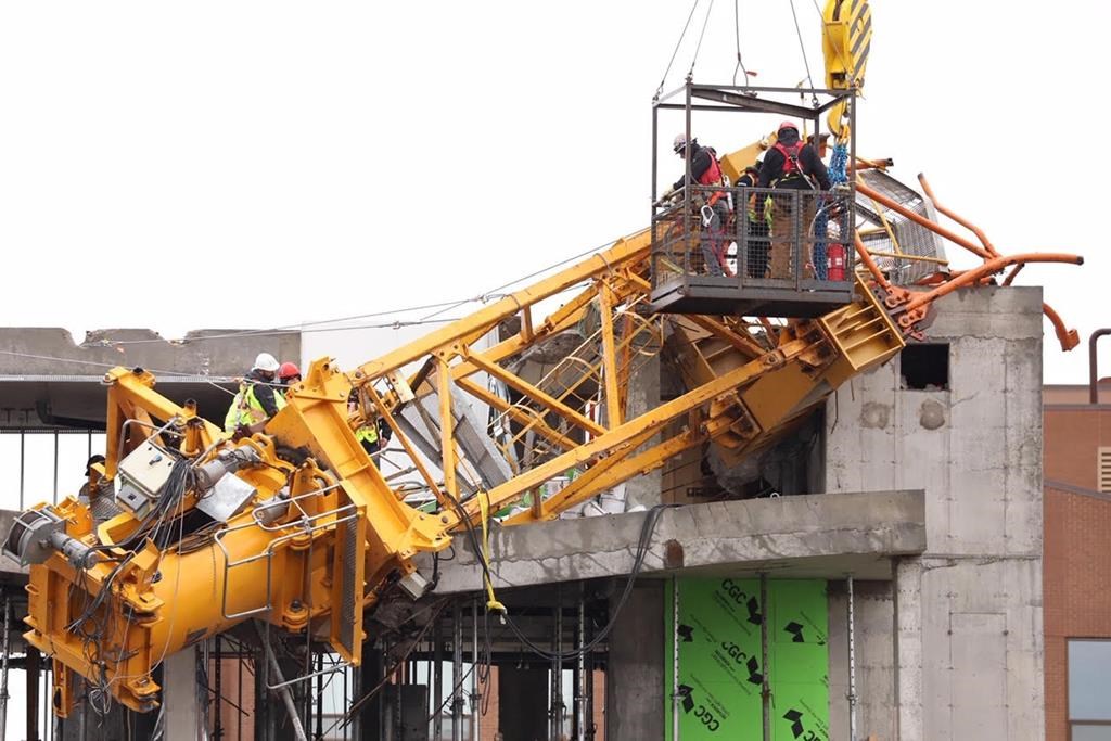 Crews remove the final pieces of a crane that collapsed onto a building in Halifax during post-tropical storm Dorian.