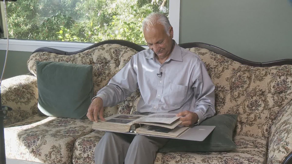 Manjit Virk looks through a photo album filled with pictures of his daughter, Reena.  Reena Virk was murdered in 1997 when she was just 14-years-old.