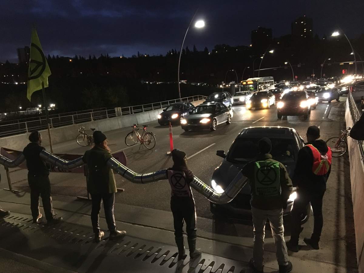 Activists with the Extinction Rebellion movement blocking the Walterdale Bridge into downtown Edmonton Monday morning as part of international protests demanding new climate policies. Monday, October 7, 2019.